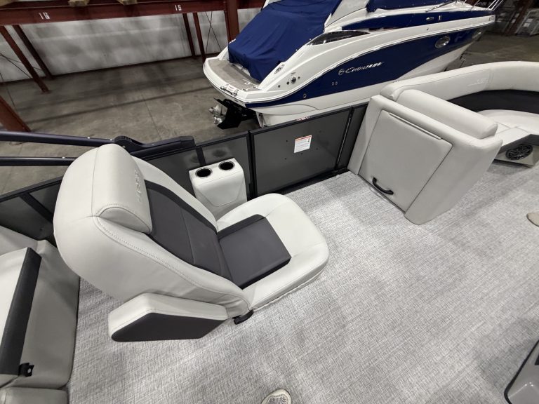 Comfortable boat seats with a boat in the background at Hall's Sport Center.