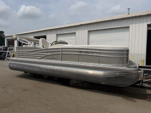 Bennington 2275 RL pontoon boat parked outside Hall's Sport Center.