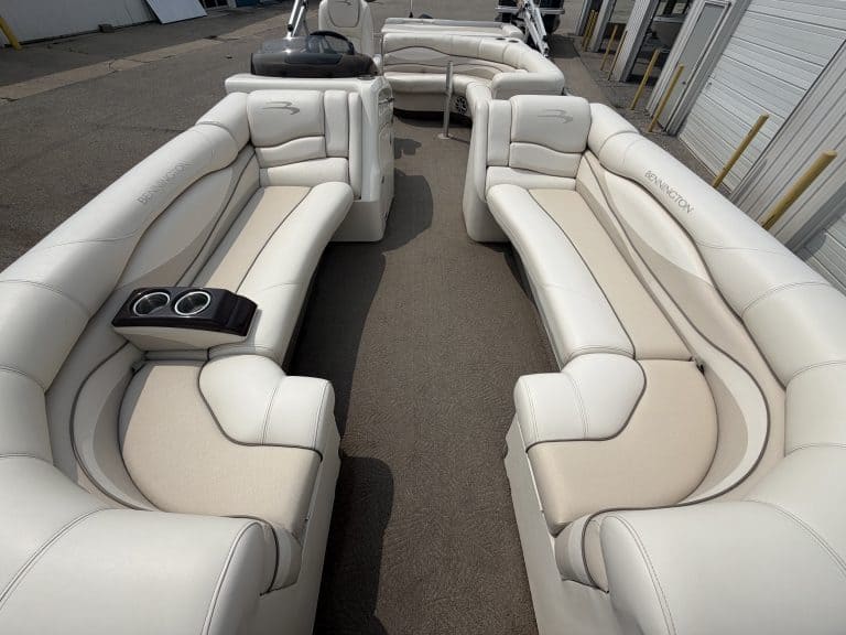 Luxury white pontoon boat seats with cup holders at Hall's Sport Center.