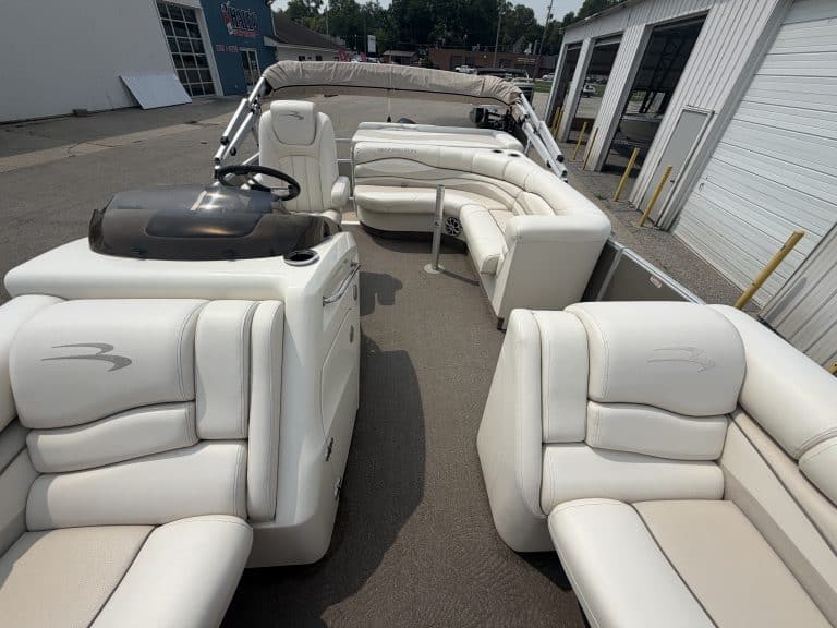 Luxury white pontoon boat with seating for family and friends.