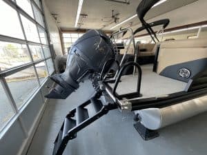 Pontoon boat with outboard motor at Hall's Sport Center.