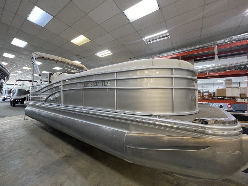 Bennington 2275 RL pontoon boat inside showroom at Hall's Sport Center.