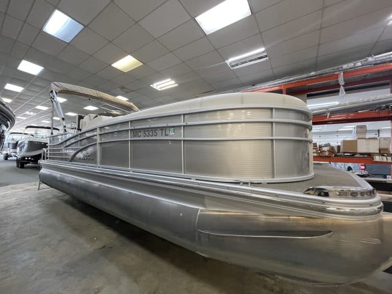 Bennington 2275 RL pontoon boat inside showroom at Hall's Sport Center.
