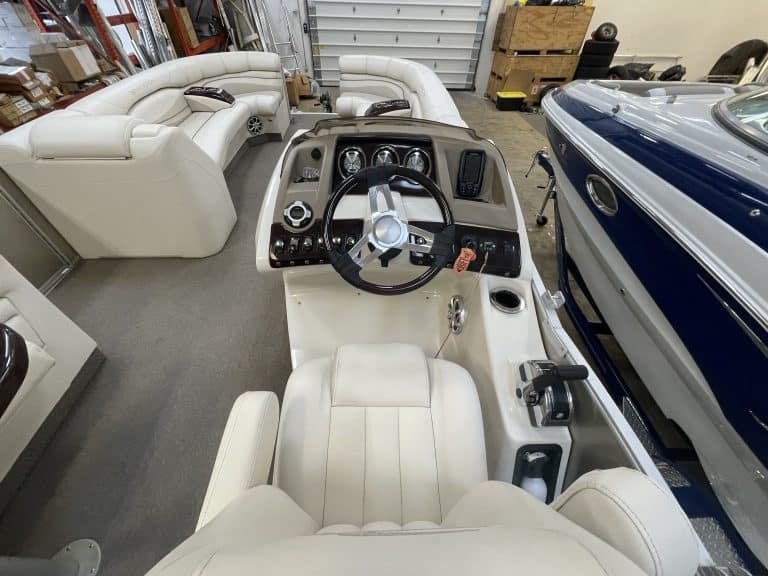 Close-up of boat dashboard and steering wheel at Hall's Sport Center.