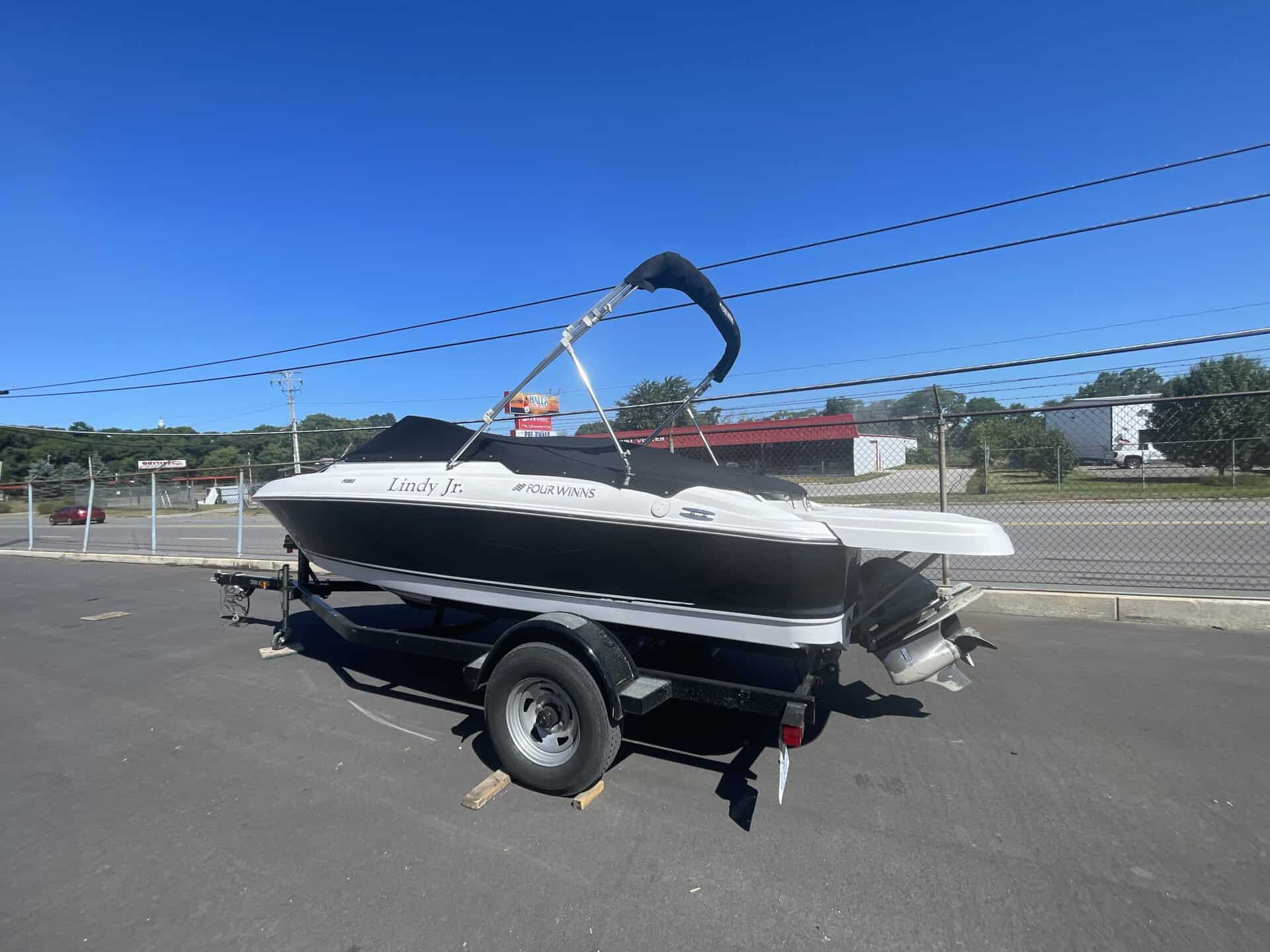 2011 Four Winns 180H boat on trailer at Hall's Sport Center.
