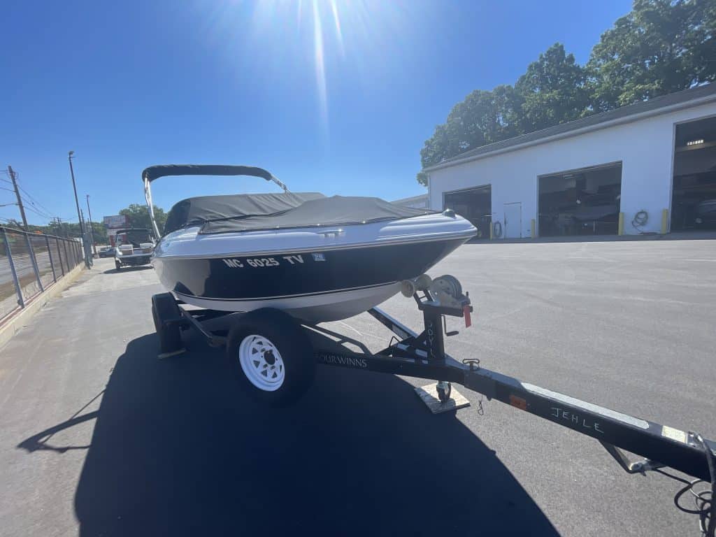 Four Winns 180H boat on trailer at Hall's Sport Center.
