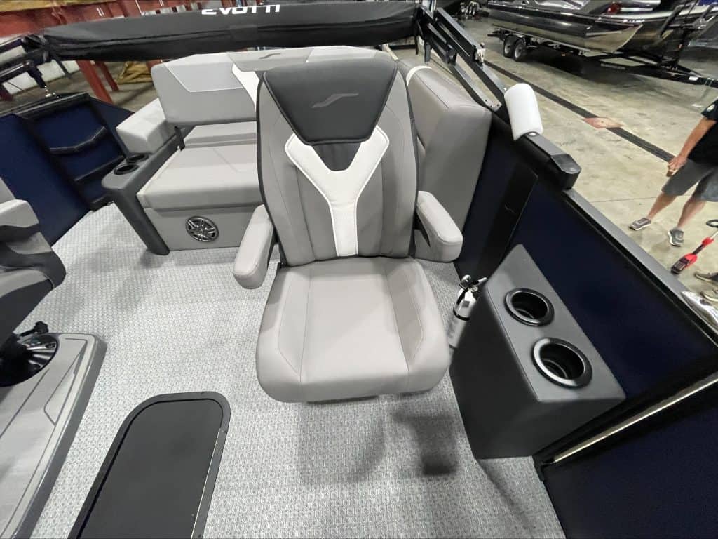 Luxury boat captain seat with armrests and cup holders at Hall's Sport Center.