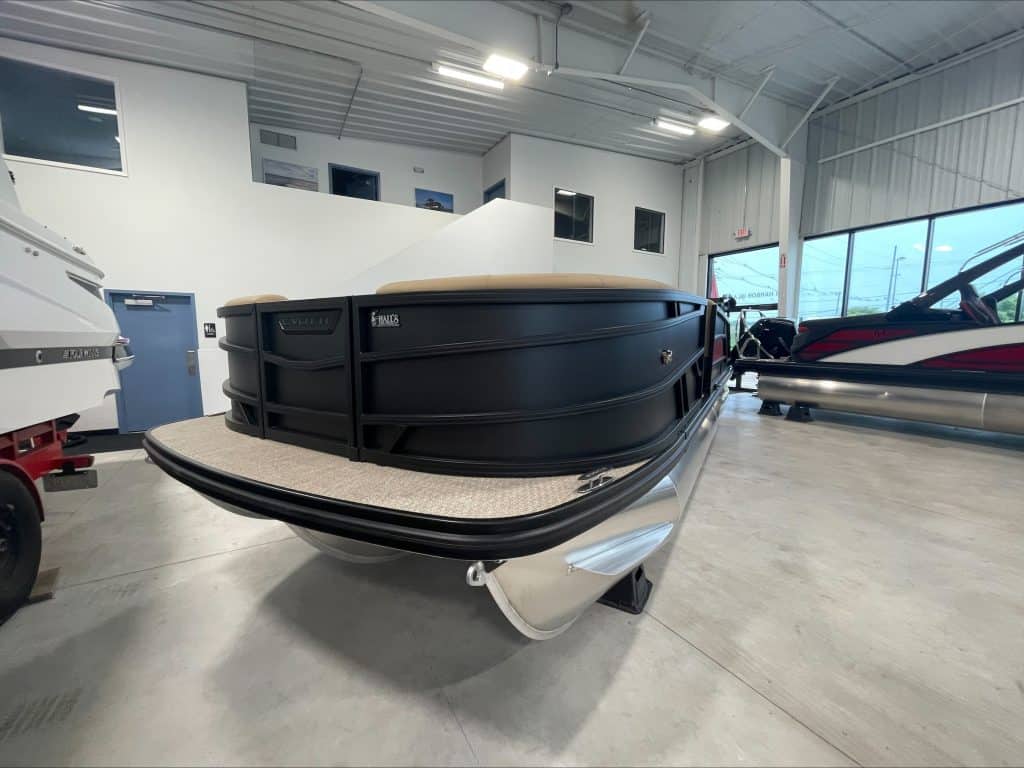 Luxury pontoon boat at Hall's Sport Center with spacious deck and sleek design.