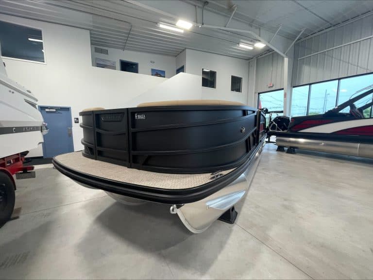 Luxury pontoon boat at Hall's Sport Center with spacious deck and sleek design.