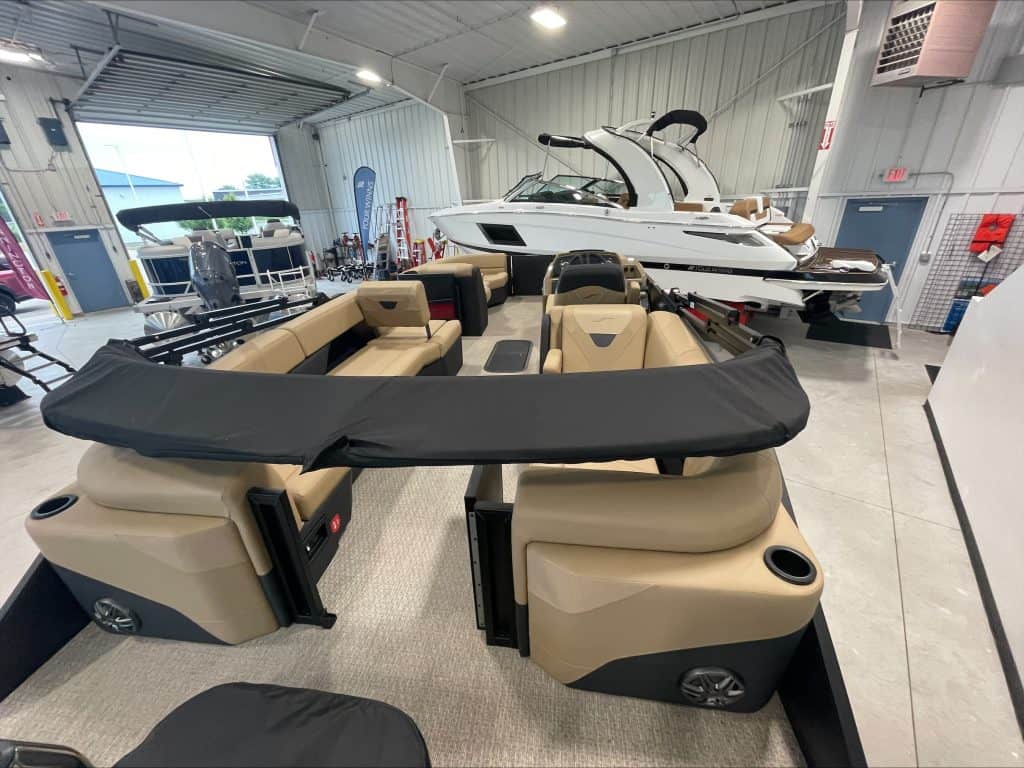 Premium pontoon boats displayed at Hall's Sport Center showroom.