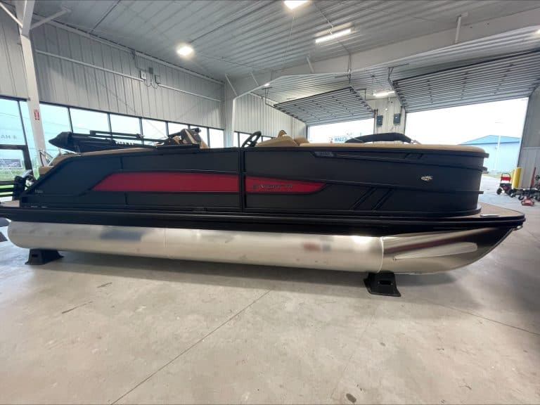 Luxury pontoon boat at Hall's Sport Center with sleek design and modern features.