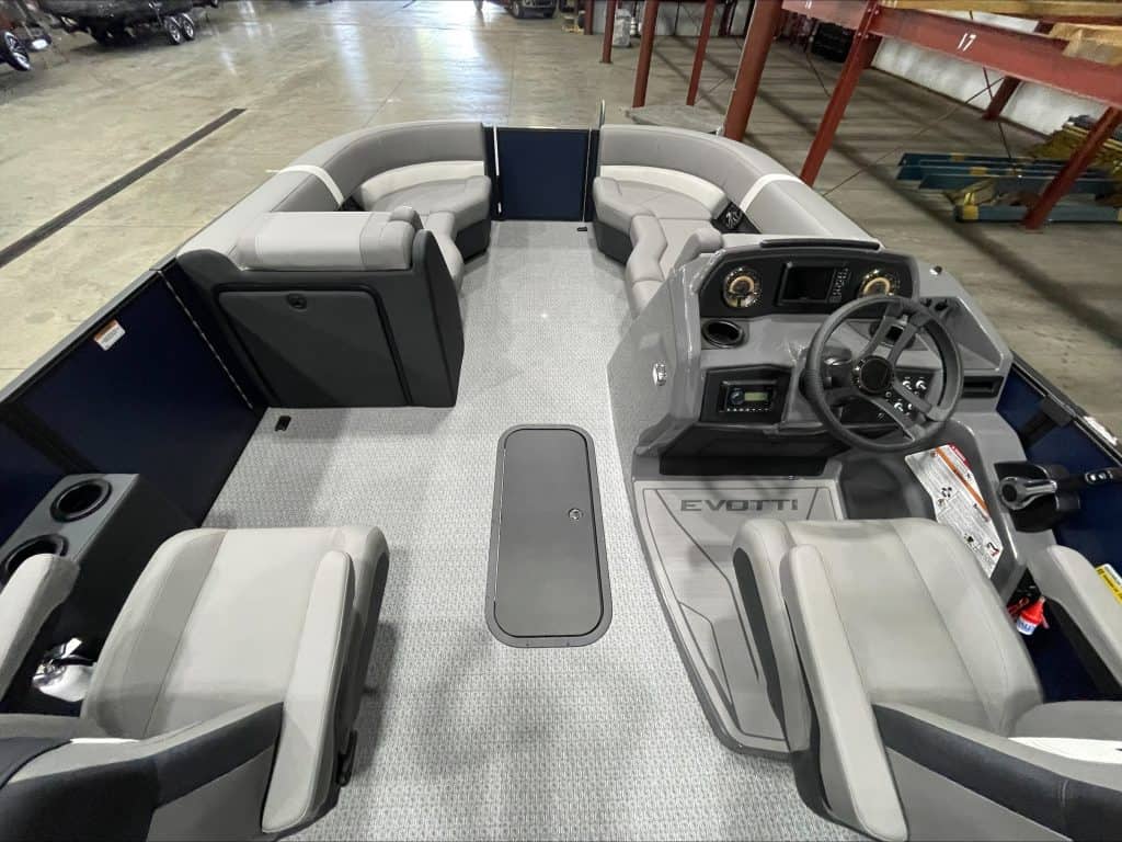 Interior view of the EVOTTI 521CS pontoon boat with seating and steering wheel.