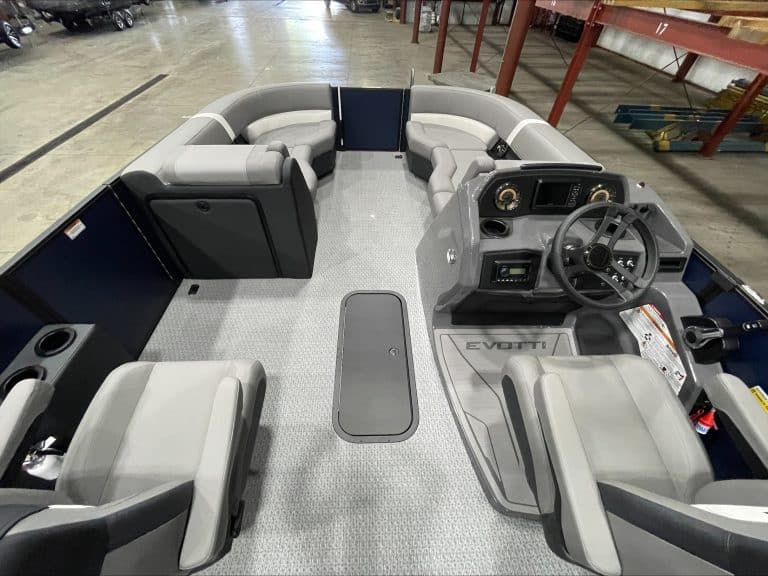 Interior view of the EVOTTI 521CS pontoon boat with seating and steering wheel.