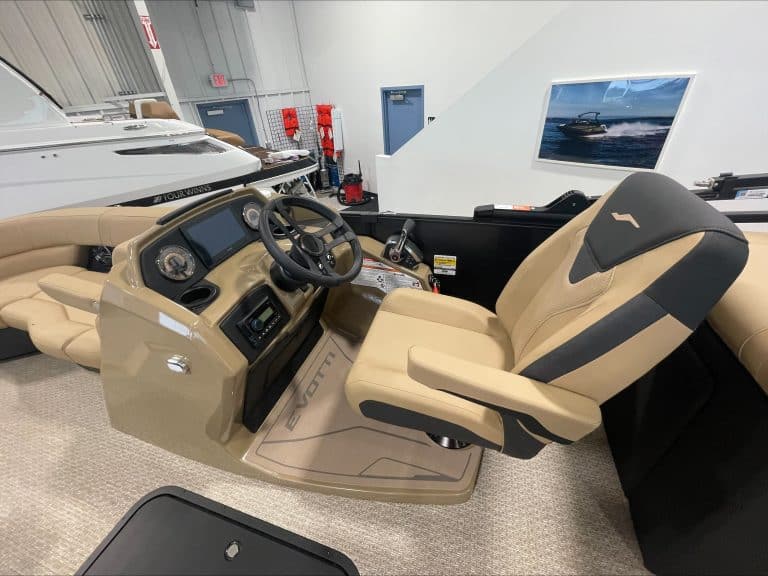 Boat helm with steering wheel and navigation controls at Hall's Sport Center.