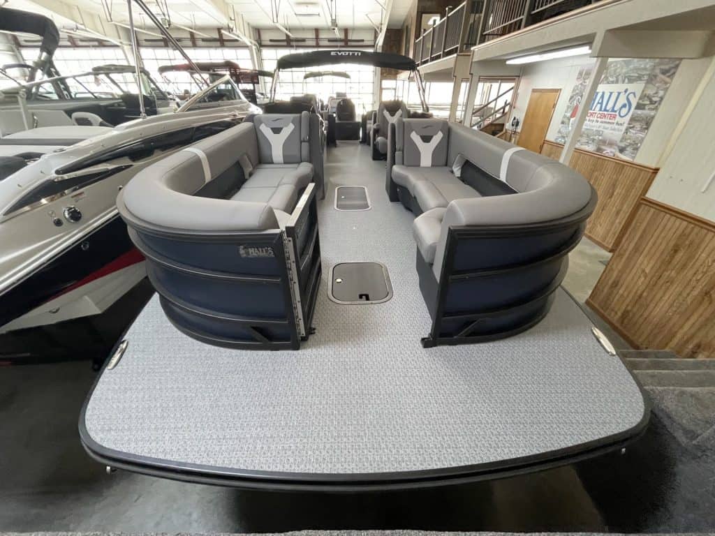 Luxury pontoon boat displayed at Hall's Sport Center for sale or demo.