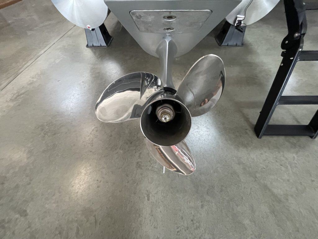 Boat propeller on concrete floor at Hall's Sport Center.