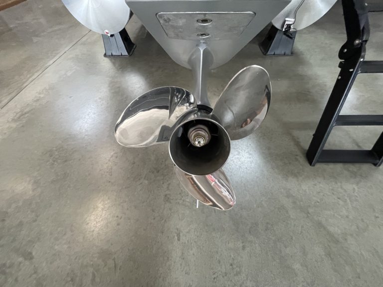 Boat propeller on concrete floor at Hall's Sport Center.