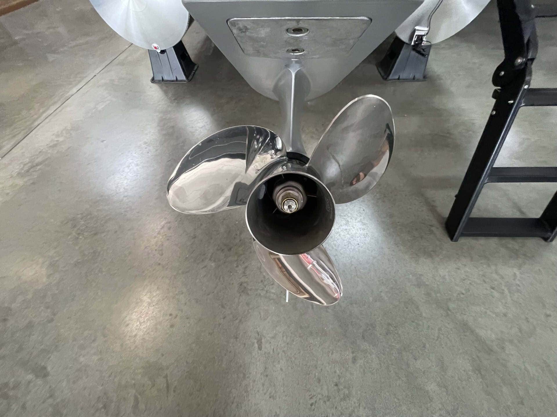 Boat propeller on concrete floor at Hall's Sport Center.