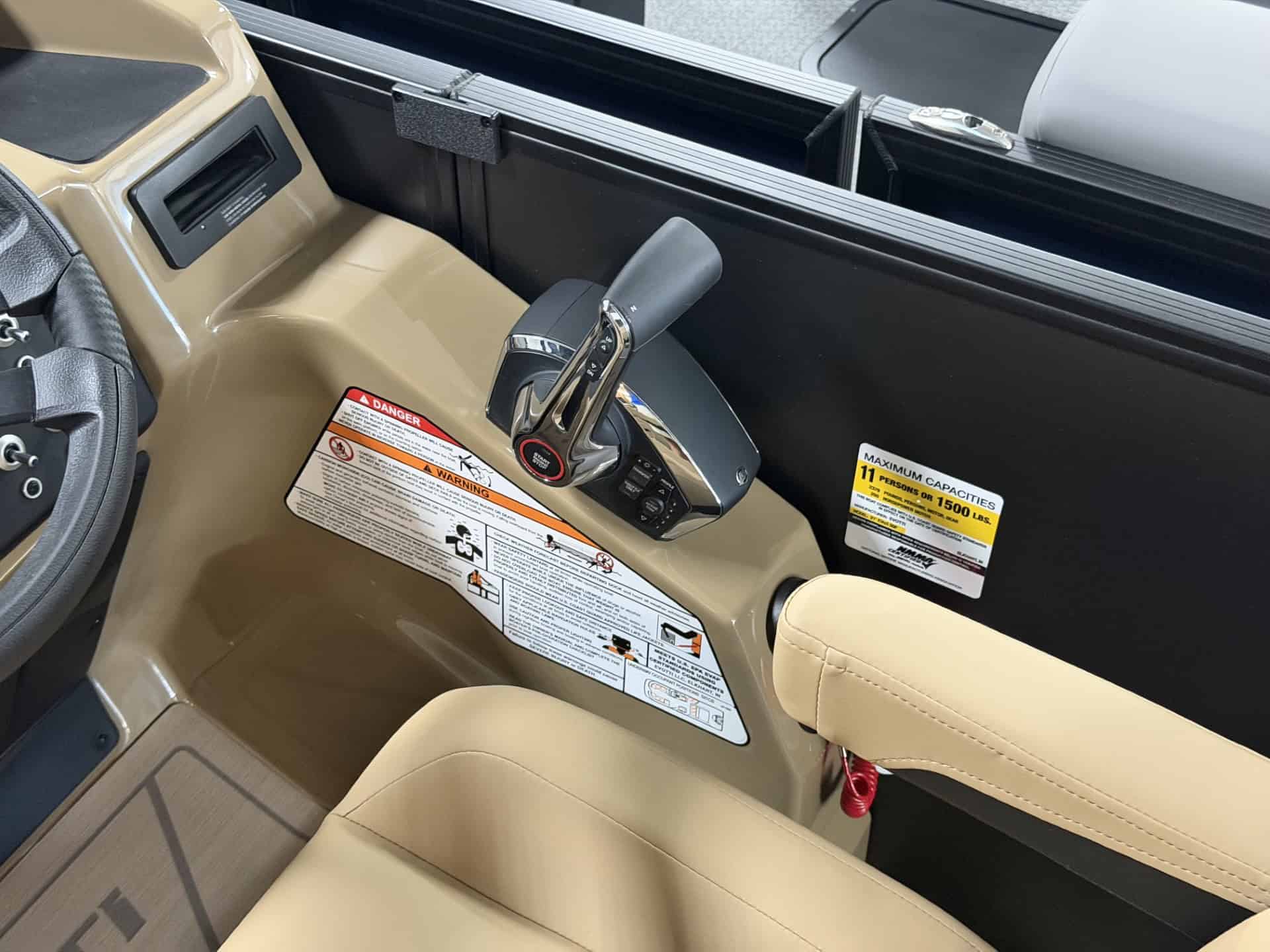 Close-up of the gear shift and dashboard of a 2027 EVOTTI 521CS golf cart.