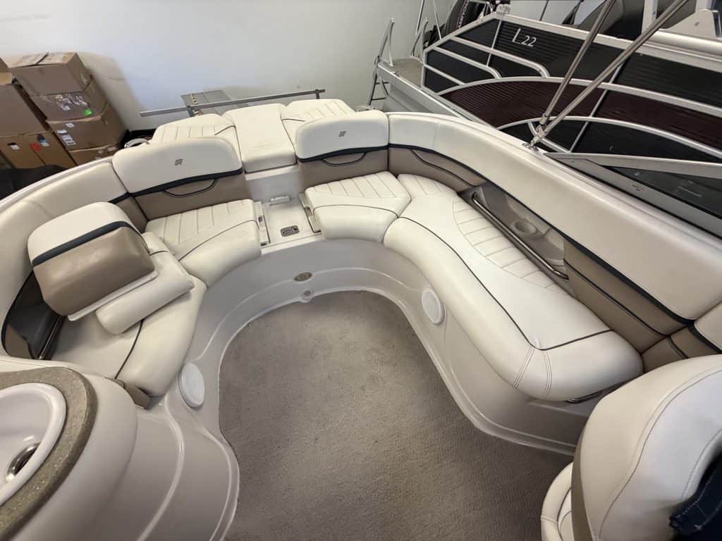 Luxury boat interior with white seating and spacious layout at Hall's Sport Center.