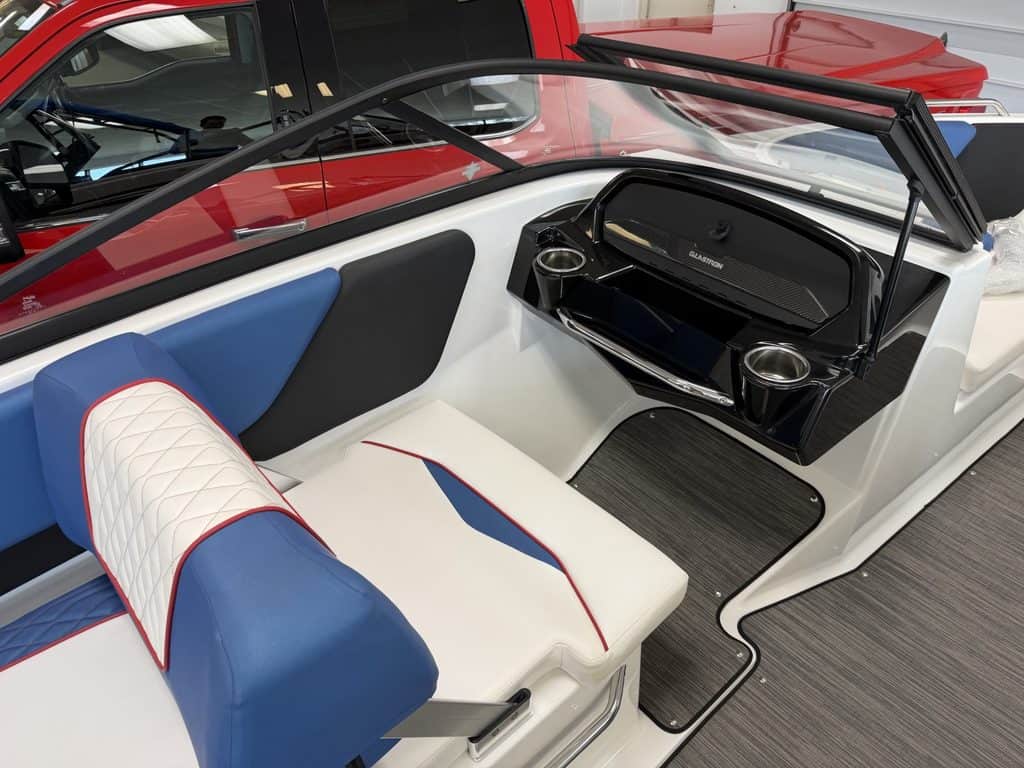 Interior view of the Glastron GX215 boat with seating and dashboard.