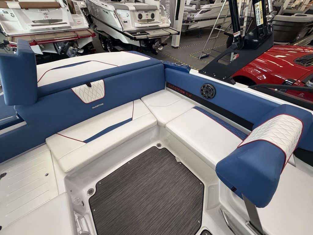 Close-up of the seating area inside a Glastron GX215 boat.