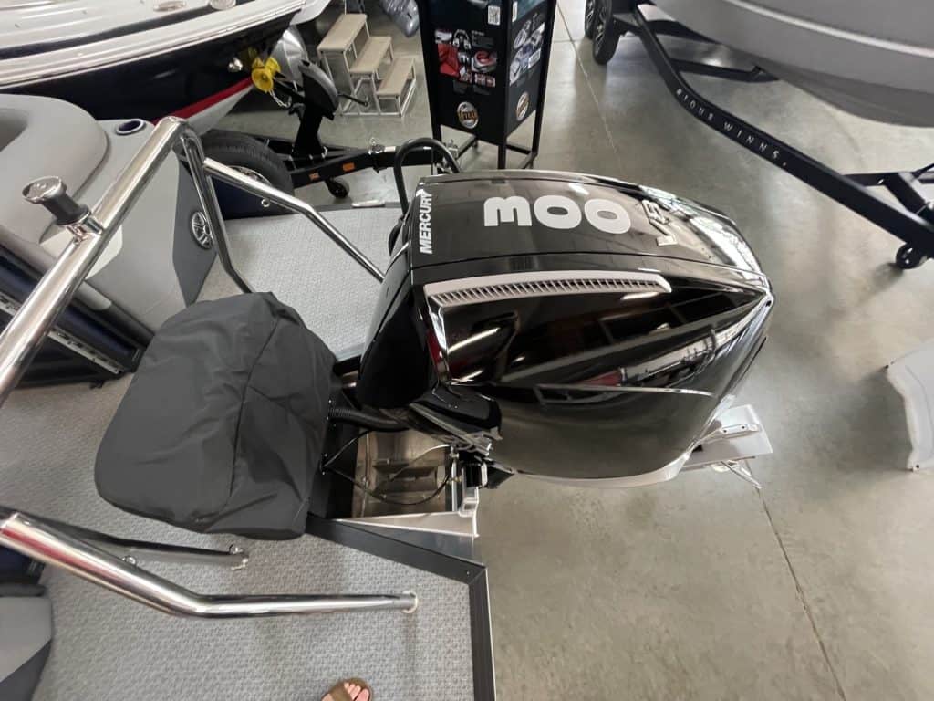 Outboard motor for boat at Hall's Sport Center.