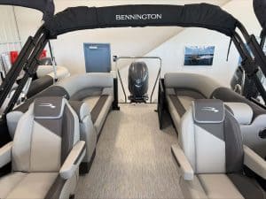 Bennington pontoon boat interior with seating and steering console.