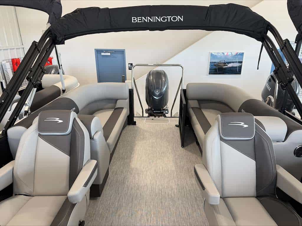 Bennington pontoon boat interior with seating and steering console.