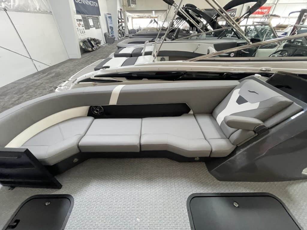 Luxury boat interior with white seating and modern design at Hall's Sport Center.