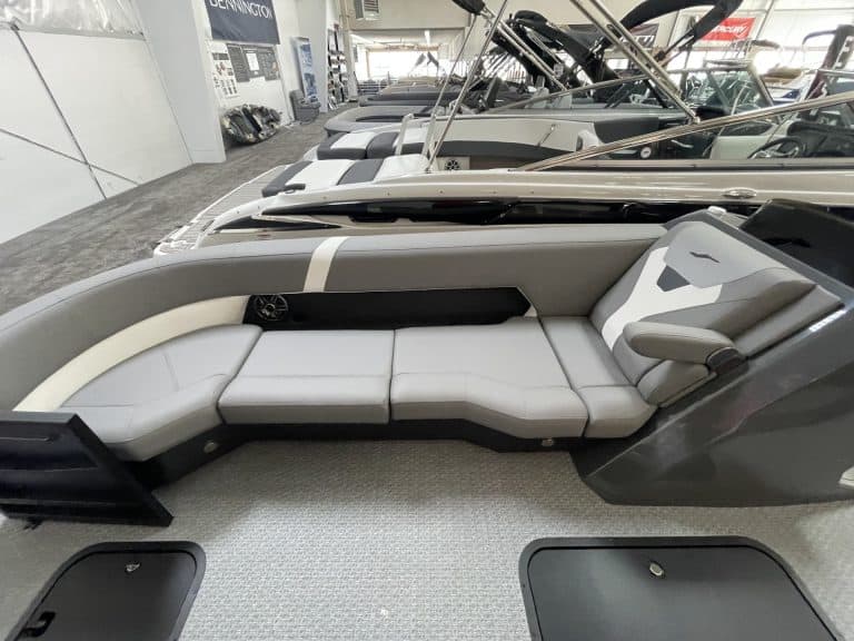 Luxury boat interior with white seating and modern design at Hall's Sport Center.