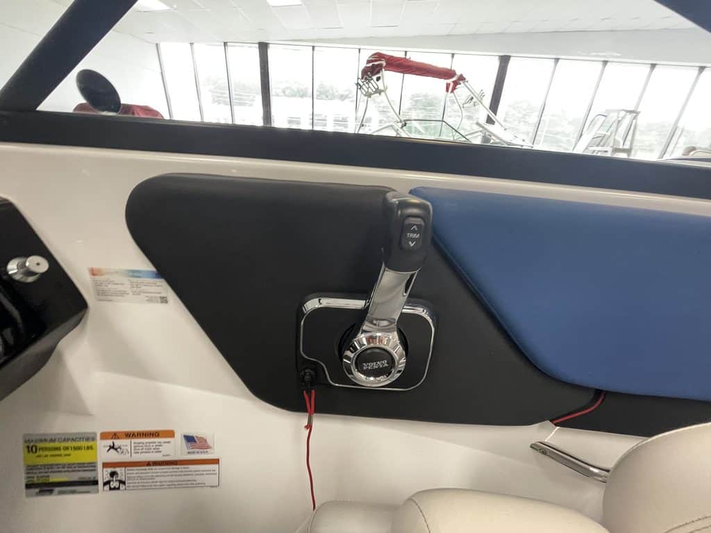 Close-up of boat dashboard with steering and controls at Hall's Sport Center.
