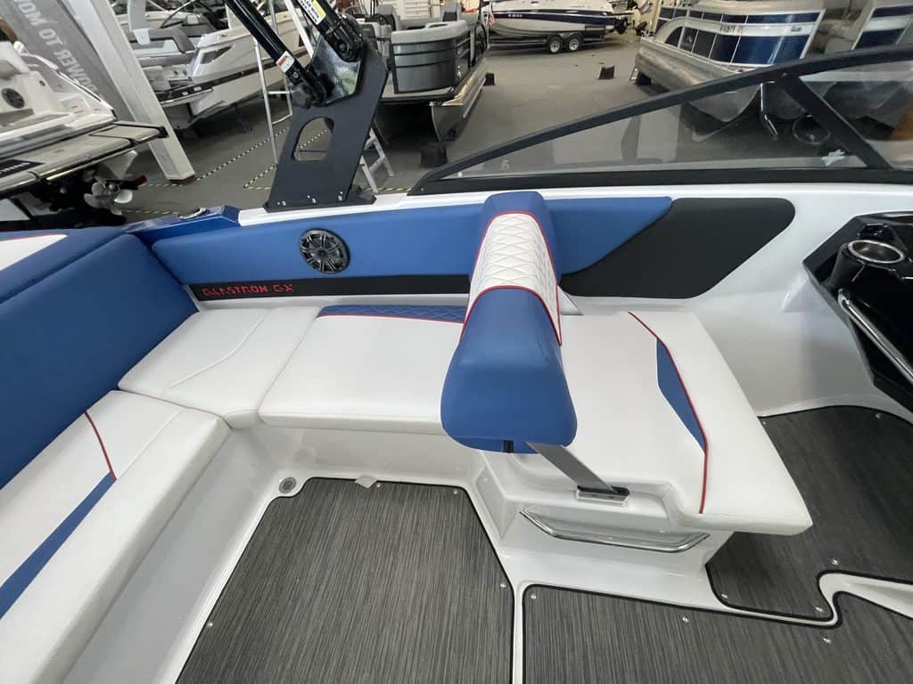 Interior view of a Glastron GX215 boat with seating and dashboard.
