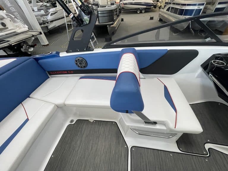 Interior view of a Glastron GX215 boat with seating and dashboard.