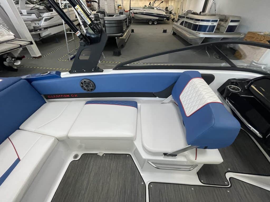 Close-up of the luxurious seating and dashboard of the Glastron GX215 boat.