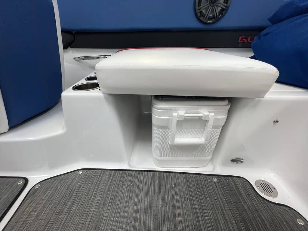 Close-up of boat seating and storage compartment on a Glastron GX215.