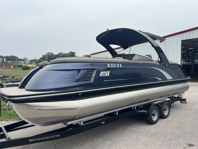 Bennington 25QXFBWA pontoon boat on trailer at Hall's Sport Center.