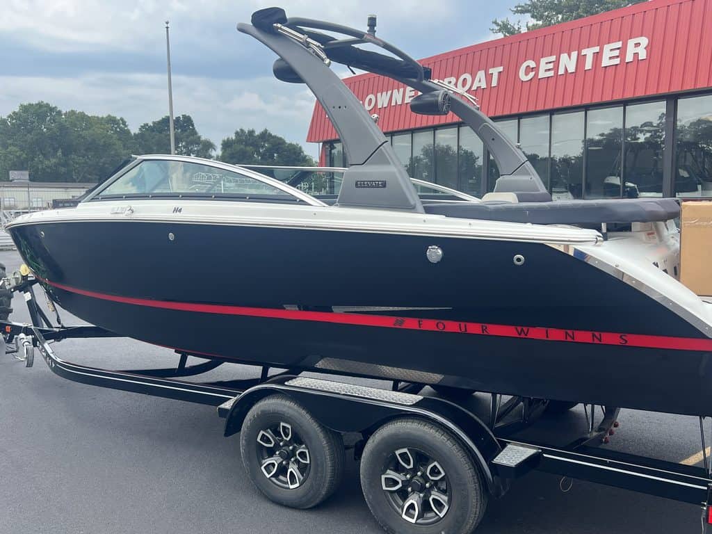 Four Winns H4 boat on trailer at Hall's Sport Center for sale or display.