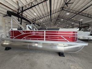 Bennington 20 S1SR pontoon boat inside Hall's Sport Center.