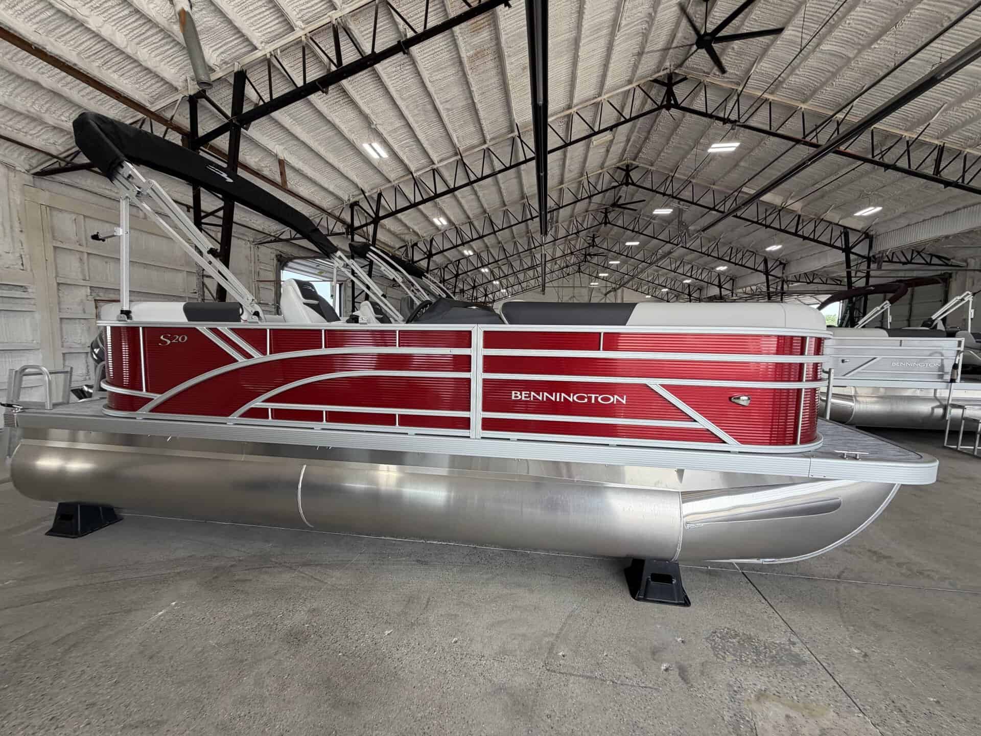 Bennington 20 S1SR pontoon boat inside Hall's Sport Center.
