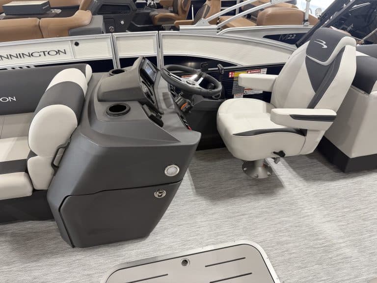 Bennington 22 S1SR pontoon boat cockpit with steering and seating.