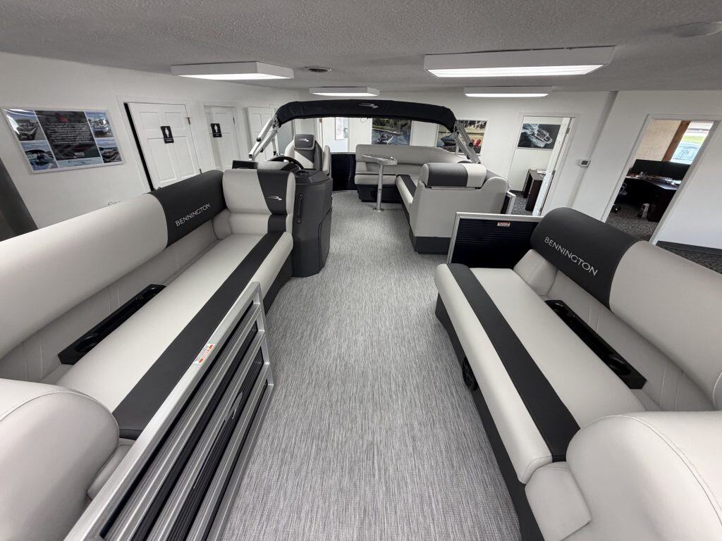 Luxury boat interior with seating and steering console at Hall's Sport Center.