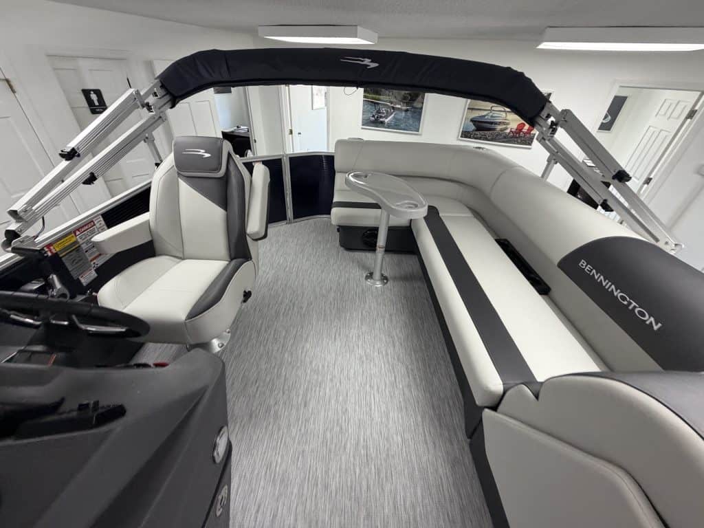 Bennington 20SL S1 pontoon boat interior with seating and steering console.