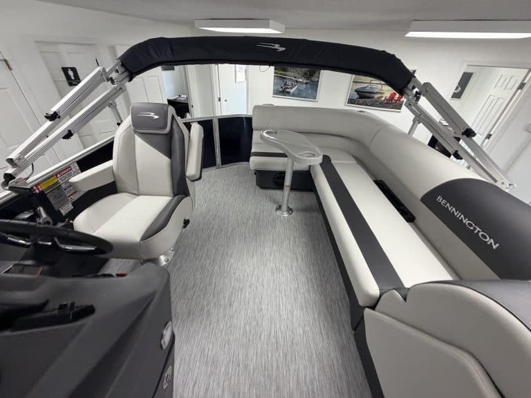 Bennington 20SL S1 pontoon boat interior with seating and steering console.