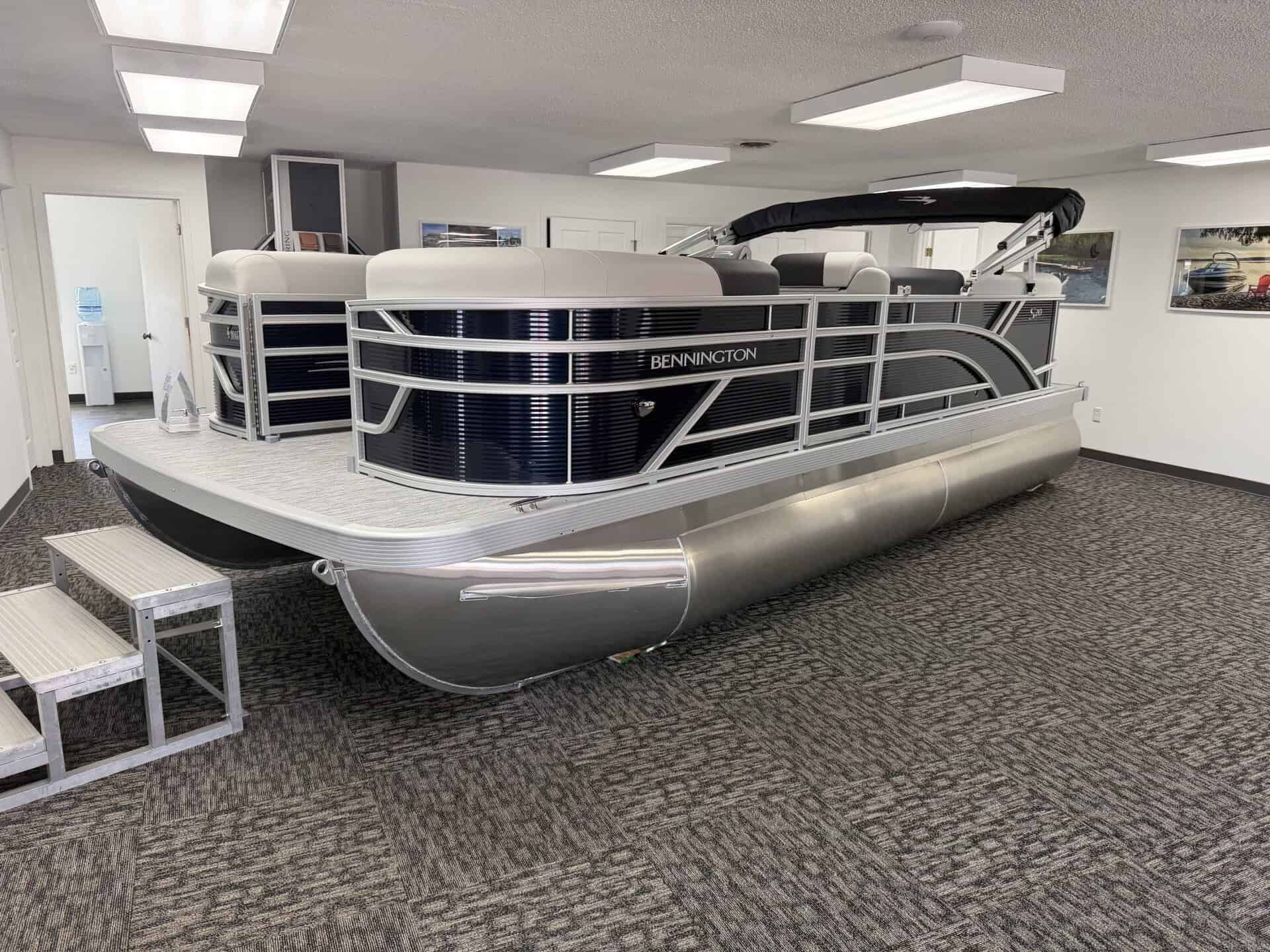 Bennington 20SL S1 pontoon boat displayed indoors at Hall's Sport Center.