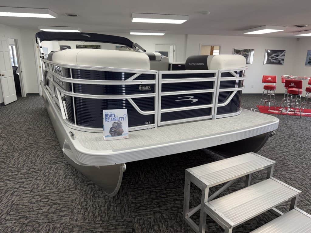 Bennington 20SL S1 pontoon boat displayed indoors at Hall's Sport Center.