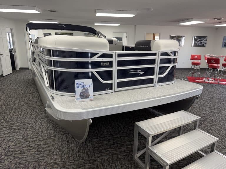 Bennington 20SL S1 pontoon boat displayed indoors at Hall's Sport Center.