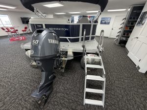 Bennington 20SL S1 pontoon boat with Yamaha engine on showroom floor.