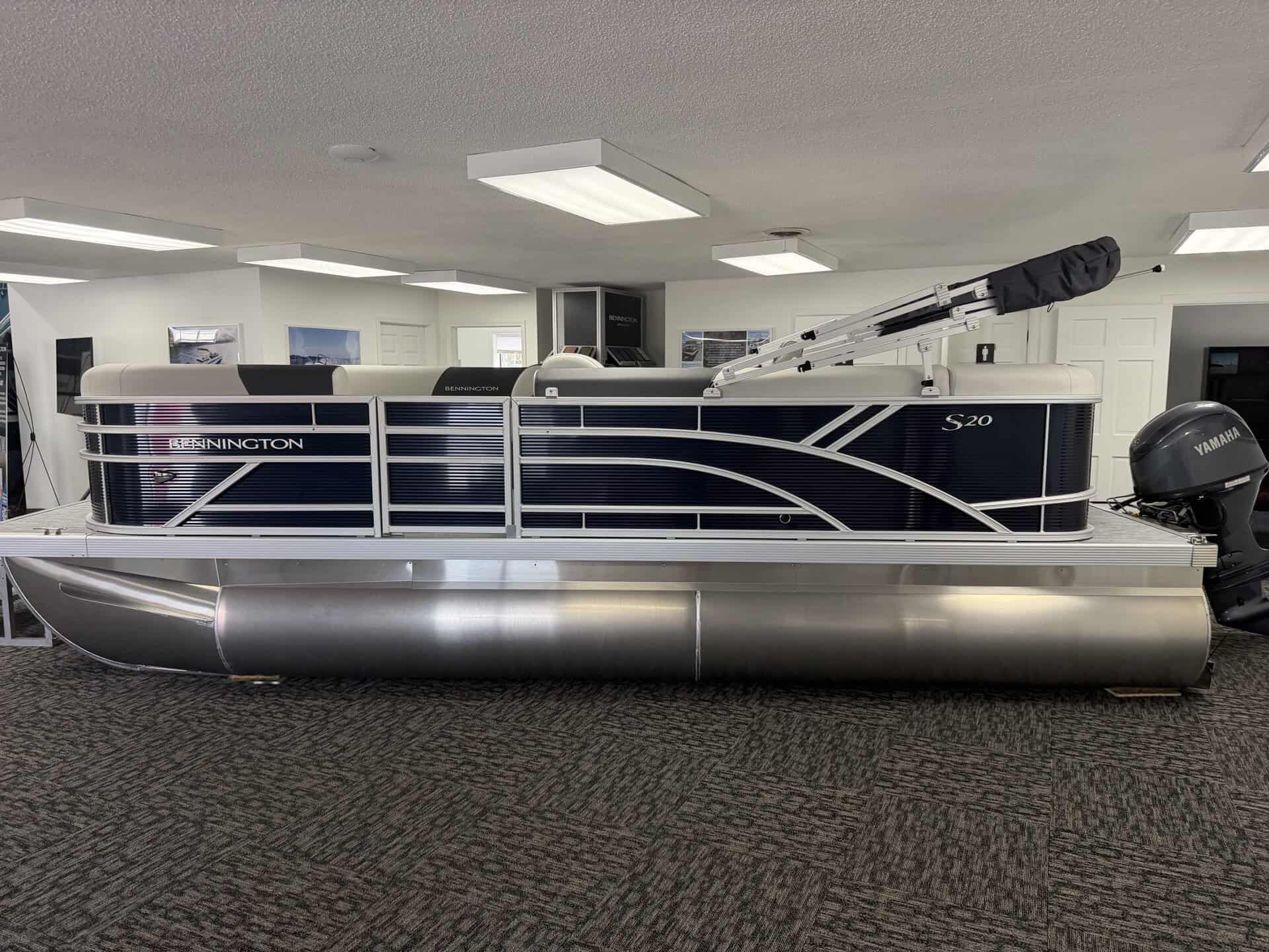 Bennington 20SL S1 pontoon boat displayed indoors at Hall's Sport Center.