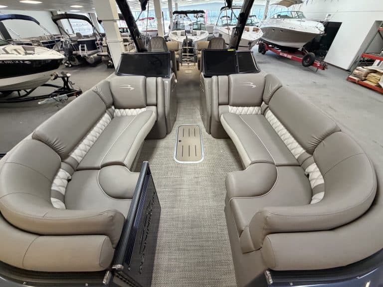 Luxury boat seating with dual captain chairs and spacious lounge area.